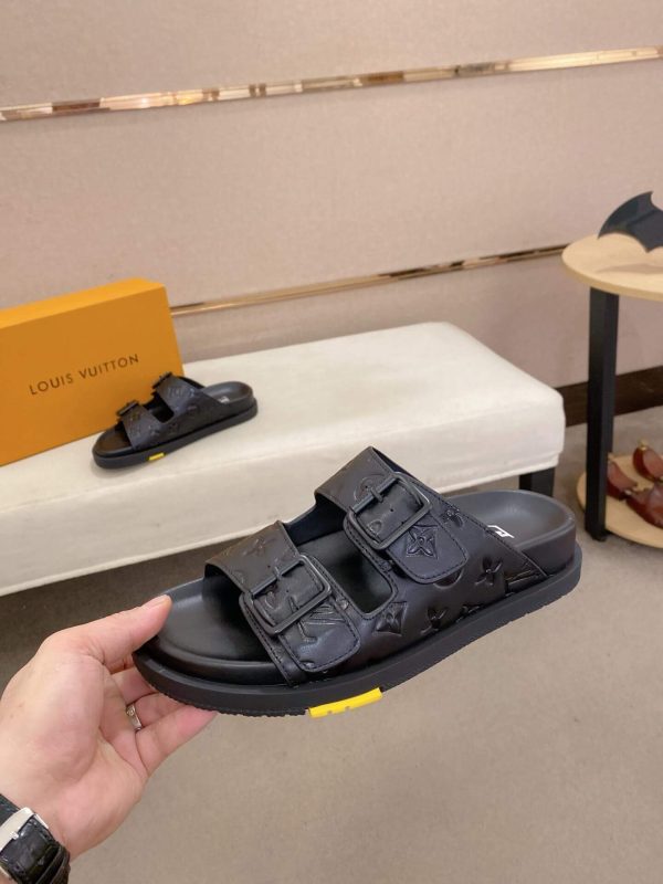 LouisVuittonslidesandals_featuringthebrand_ssignaturemonogrampatternonthestraps_4_9bb66a61-597c-45f7-ad2a-f095a0d331dd LV Venice Mule in Black Monogram Embossed Leather