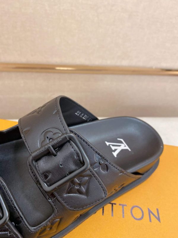 LouisVuittonslidesandals_featuringthebrand_ssignaturemonogrampatternonthestraps_7_afbf7928-1fb4-403a-b132-0e96d4230bff LV Venice Mule in Black Monogram Embossed Leather