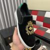 Gucci Men's Slip-On Loafers with A Gold Embellished Crest Design