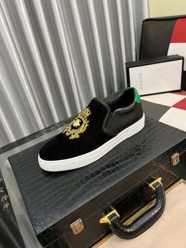 Gucci Men's Slip-On Loafers with A Gold Embellished Crest Design