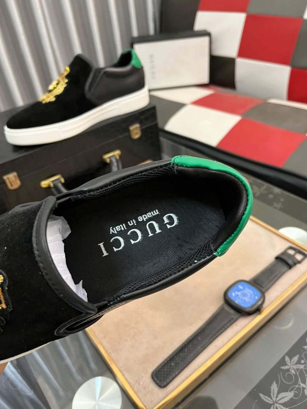 Gucci Men's Slip-On Loafers with A Gold Embellished Crest Design