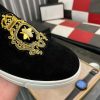 Gucci Men's Slip-On Loafers with A Gold Embellished Crest Design
