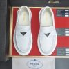 Prada Ivory Leather Platform Loafers with Enamel Triangle Logo