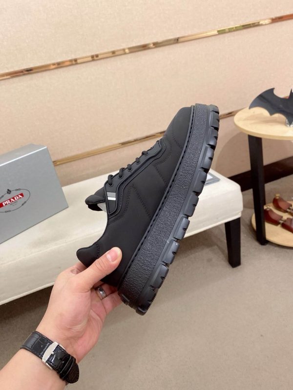 PradaDowntownLeatherSneakers_1_df39fd80-3a41-410d-8fd4-3df6534a2606 Prada Black Re-Nylon Sneakers