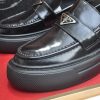 Prada Black Polished Leather Platform Loafers with Enamel Triangle Logo