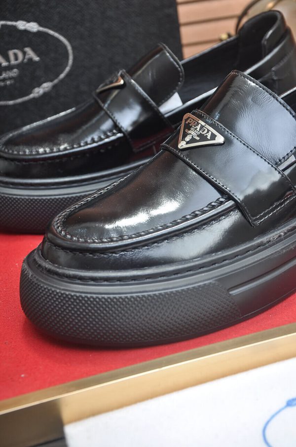 Prada Black Polished Leather Platform Loafers with Enamel Triangle Logo
