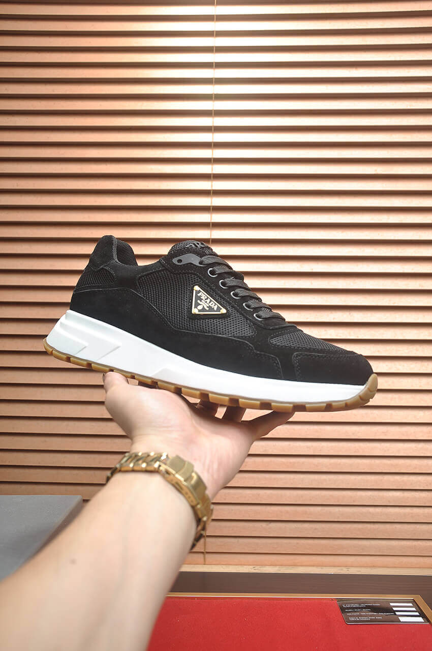 Prada Prax 2.0 Re-Nylon and Suede Sneaker in a black and white colorway. 9 Prada Prax 2.0 Re-Nylon and Suede Sneaker in a black and white colorway. - Image 9