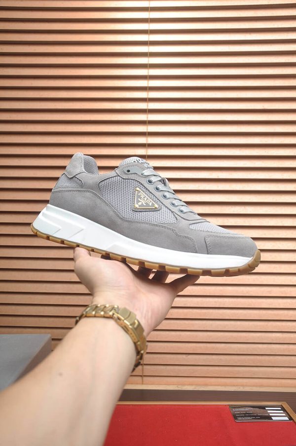 Prada Prax 2.0 Re-Nylon and Suede Sneaker in a gray colorway.