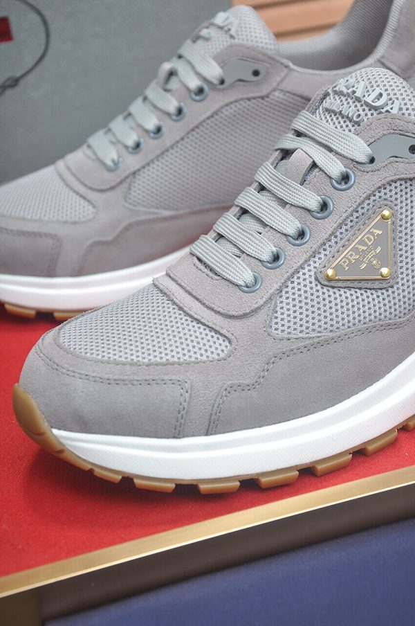 Prada Prax 2.0 Re-Nylon and Suede Sneaker in a gray colorway.
