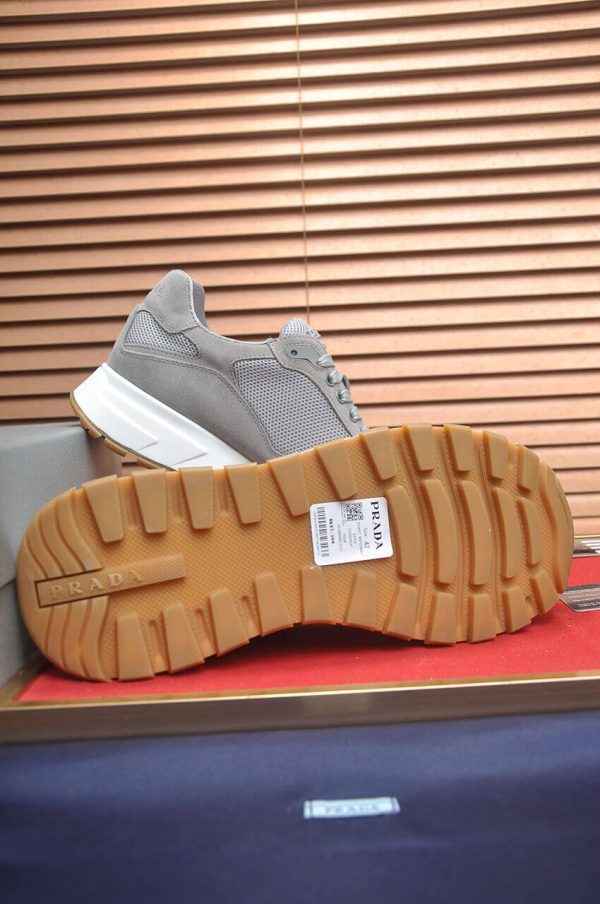 Prada Prax 2.0 Re-Nylon and Suede Sneaker in a gray colorway.