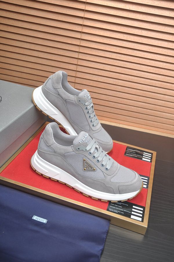 Prada Prax 2.0 Re-Nylon and Suede Sneaker in a gray colorway.