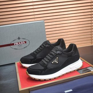 Prada Prax 2.0 Re-Nylon and Suede Sneaker in a black and white colorway.