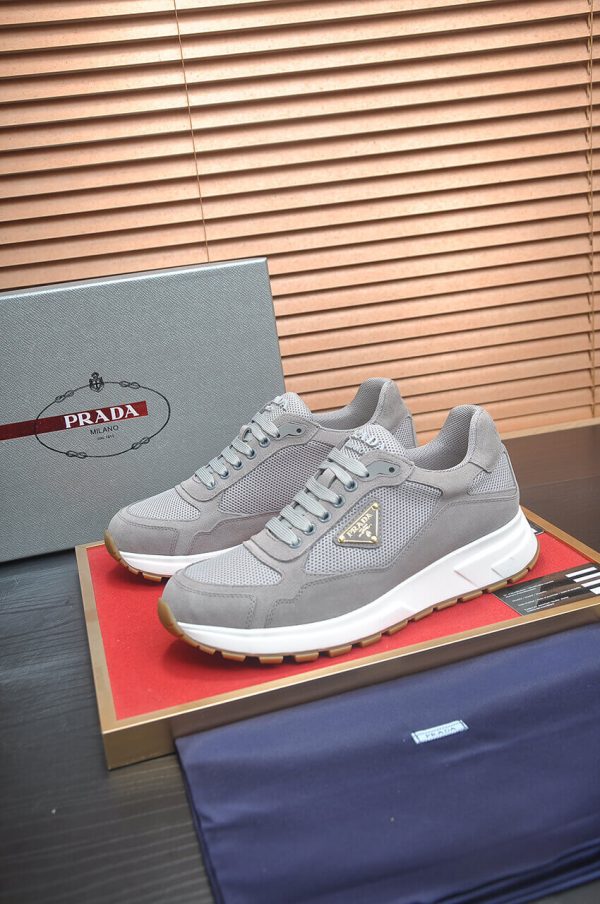 Prada Prax 2.0 Re-Nylon and Suede Sneaker in a gray colorway.
