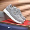 Prada Prax 2.0 Re-Nylon and Suede Sneaker in a gray colorway.