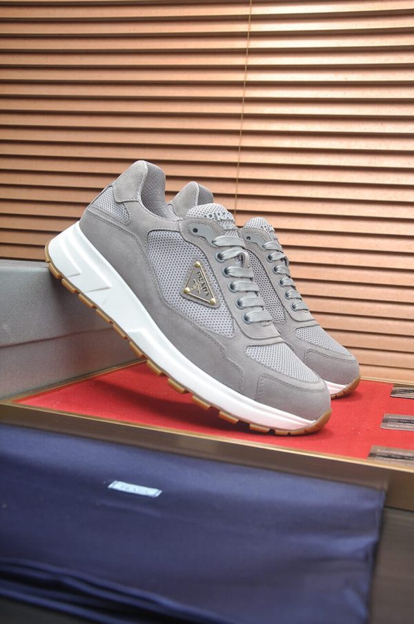 Prada Prax 2.0 Re-Nylon and Suede Sneaker in a gray colorway.