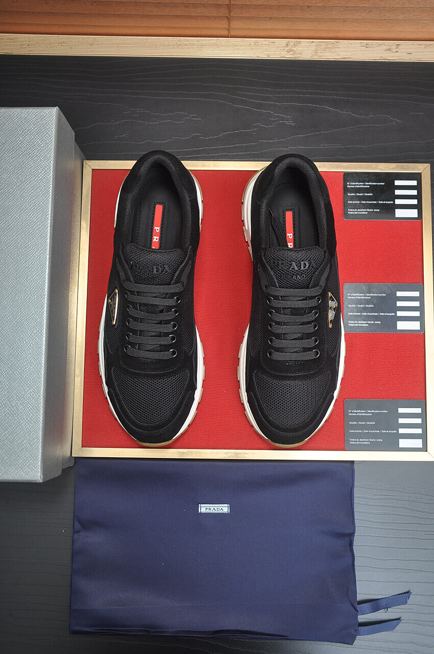 Prada Prax 2.0 Re-Nylon and Suede Sneaker in a black and white colorway. 2 Prada Prax 2.0 Re-Nylon and Suede Sneaker in a black and white colorway. - Image 2