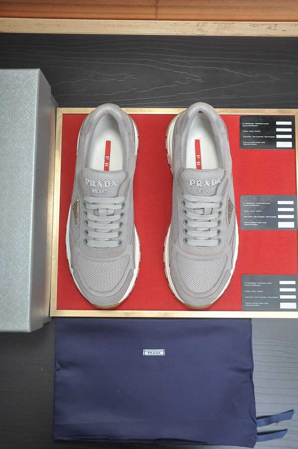 Prada Prax 2.0 Re-Nylon and Suede Sneaker in a gray colorway.