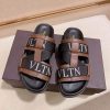 ValentinoGaravaniDelroyLeatherSlip-OnSandalinbrownleatherwithblackaccents._1 Valentino Garavani VLTN Leather Sandals in Brown