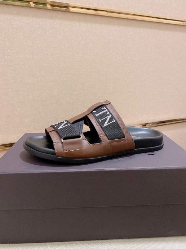 ValentinoGaravaniDelroyLeatherSlip-OnSandalinbrownleatherwithblackaccents._5 Valentino Garavani VLTN Leather Sandals in Brown