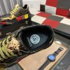 Versace Black and Gold Trigreca Sneakers with Medusa Head