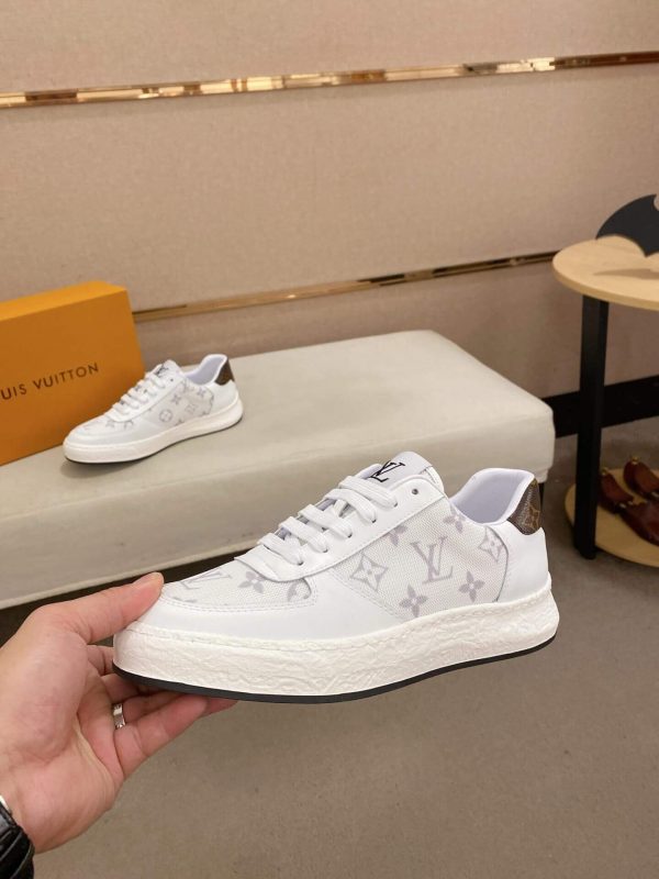 whiteLouisVuittonRivolisneakerwithagraymonogrampattern._7 LV White Monogram Canvas and White Leather Sneakers