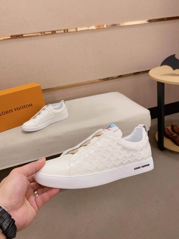 whiteLouisVuittonslip-onsneakerswiththebrand_smonogrampatternembossedontheupper._3 LV Slip-On Sneakers in White Monogram Embossed Leather