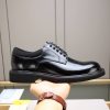 Louis Vuitton black leather lace-up derby shoes.