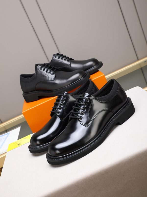 Louis Vuitton black leather lace-up derby shoes.
