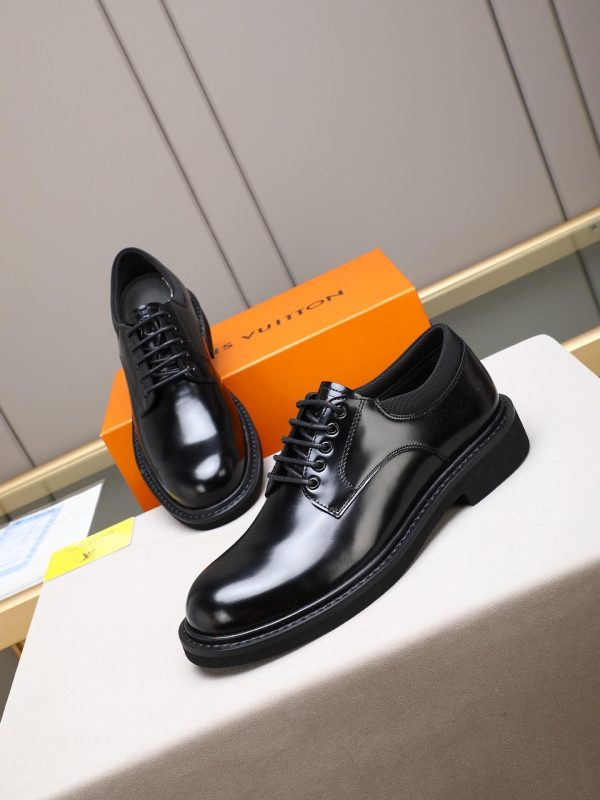 Louis Vuitton black leather lace-up derby shoes.