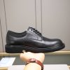 Louis Vuitton black leather lace-up derby shoes.