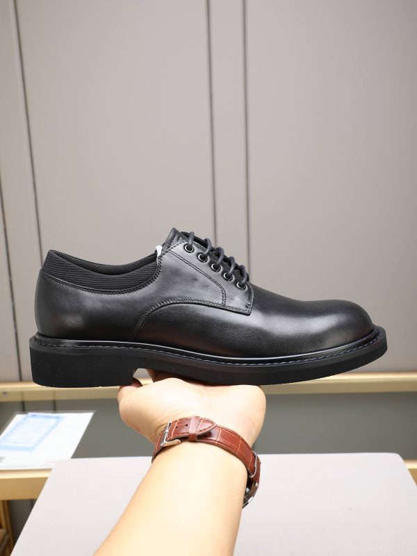 Louis Vuitton black leather lace-up derby shoes.