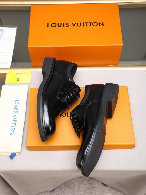 Louis Vuitton black leather lace-up derby shoes.