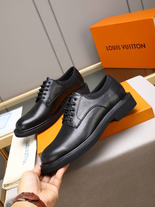 Louis Vuitton black leather lace-up derby shoes.