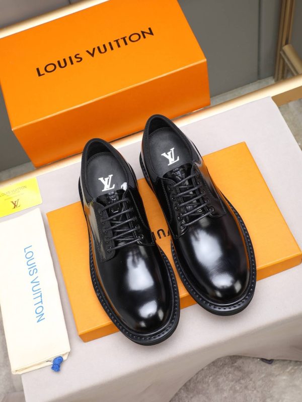 Louis Vuitton black leather lace-up derby shoes.