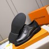 Louis Vuitton black leather lace-up derby shoes.