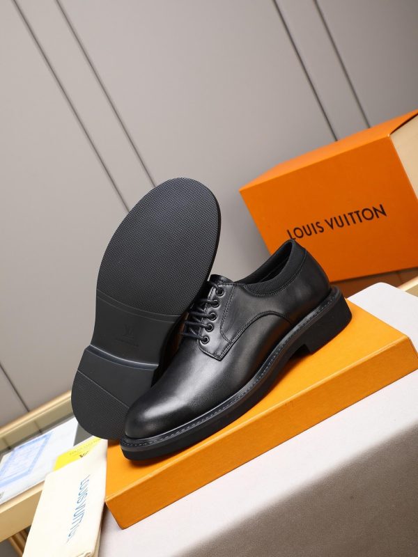 Louis Vuitton black leather lace-up derby shoes.