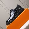 Louis Vuitton black leather lace-up derby shoes.