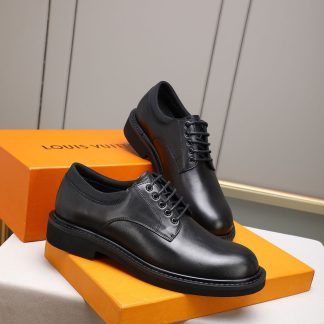 Louis Vuitton black leather lace-up derby shoes.