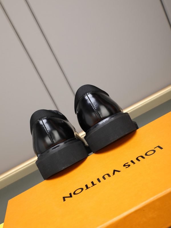 Louis Vuitton black leather lace-up derby shoes.