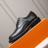 Louis Vuitton black leather lace-up derby shoes.