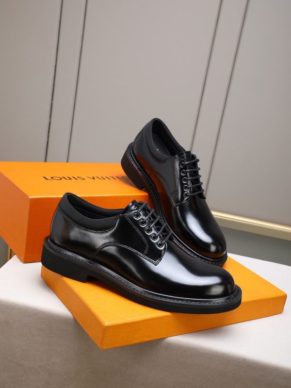 Louis Vuitton black leather lace-up derby shoes.