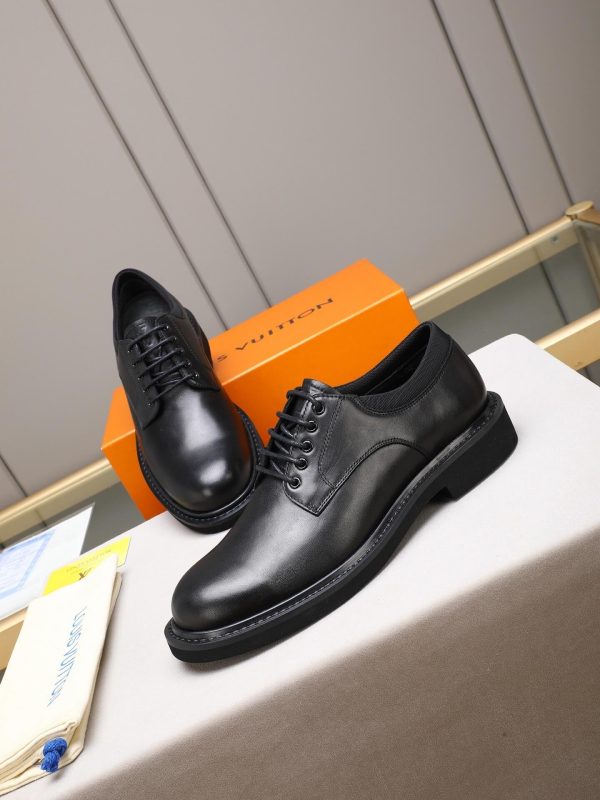 Louis Vuitton black leather lace-up derby shoes.