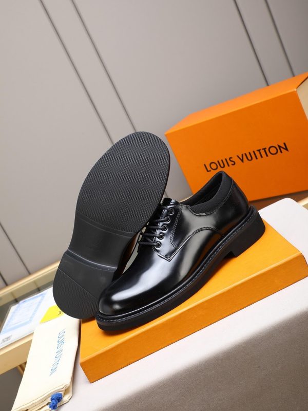 Louis Vuitton black leather lace-up derby shoes.