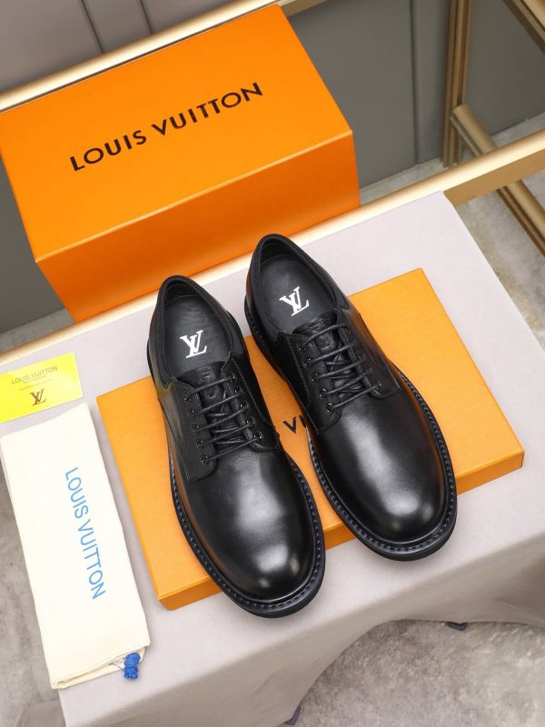Louis Vuitton black leather lace-up derby shoes.