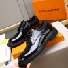 Louis Vuitton black leather lace-up derby shoes.