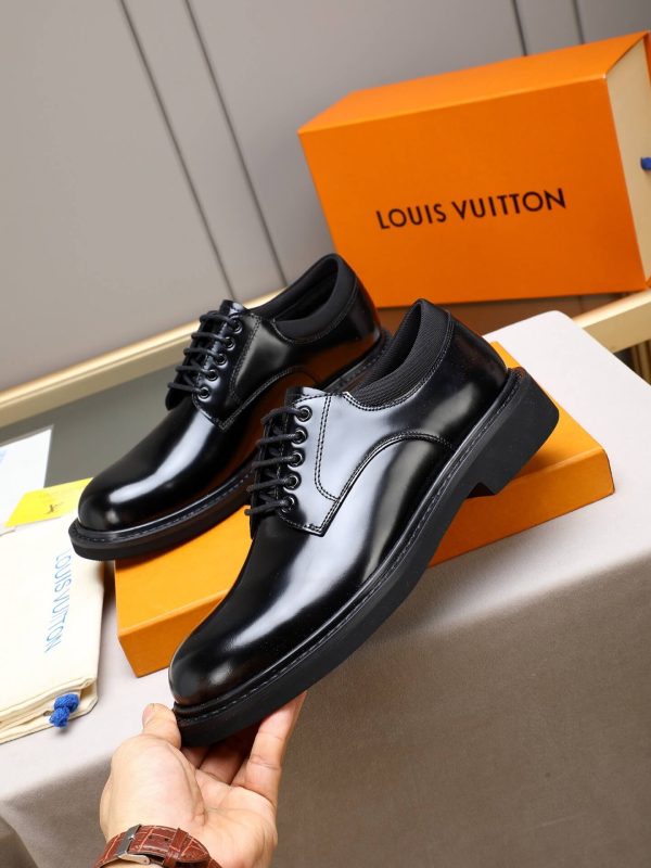 Louis Vuitton black leather lace-up derby shoes.