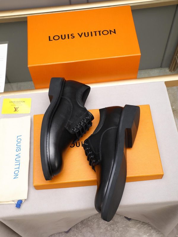 Louis Vuitton black leather lace-up derby shoes.
