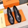 Louis Vuitton black leather monk shoes.