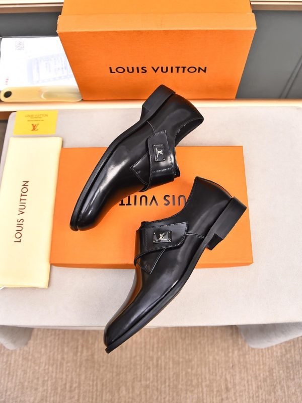 Louis Vuitton black leather monk shoes.