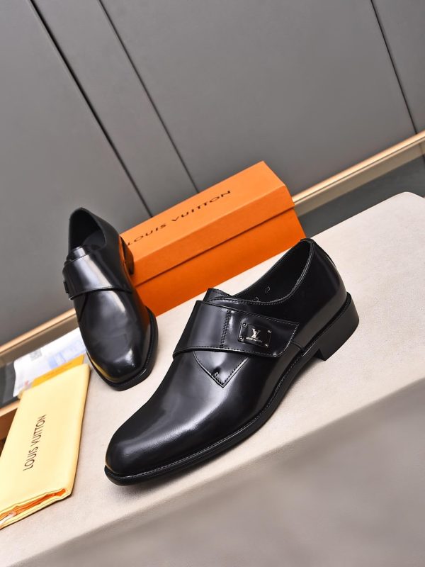 Louis Vuitton black leather monk shoes.